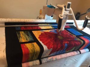 my longarm machine, a q'nique15 pro on a continuum frame, from Grace company.